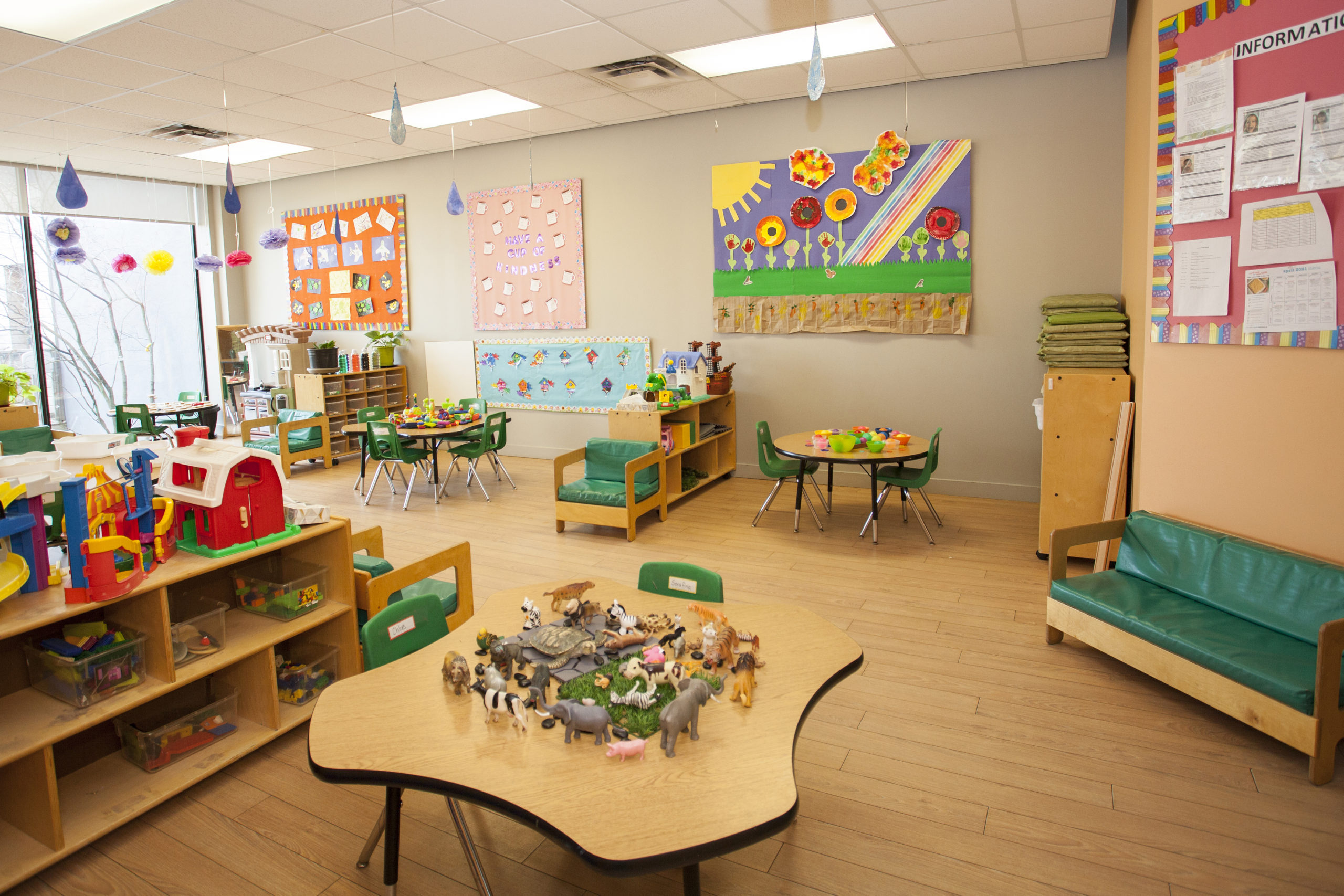 preschool classroom with tables and couches