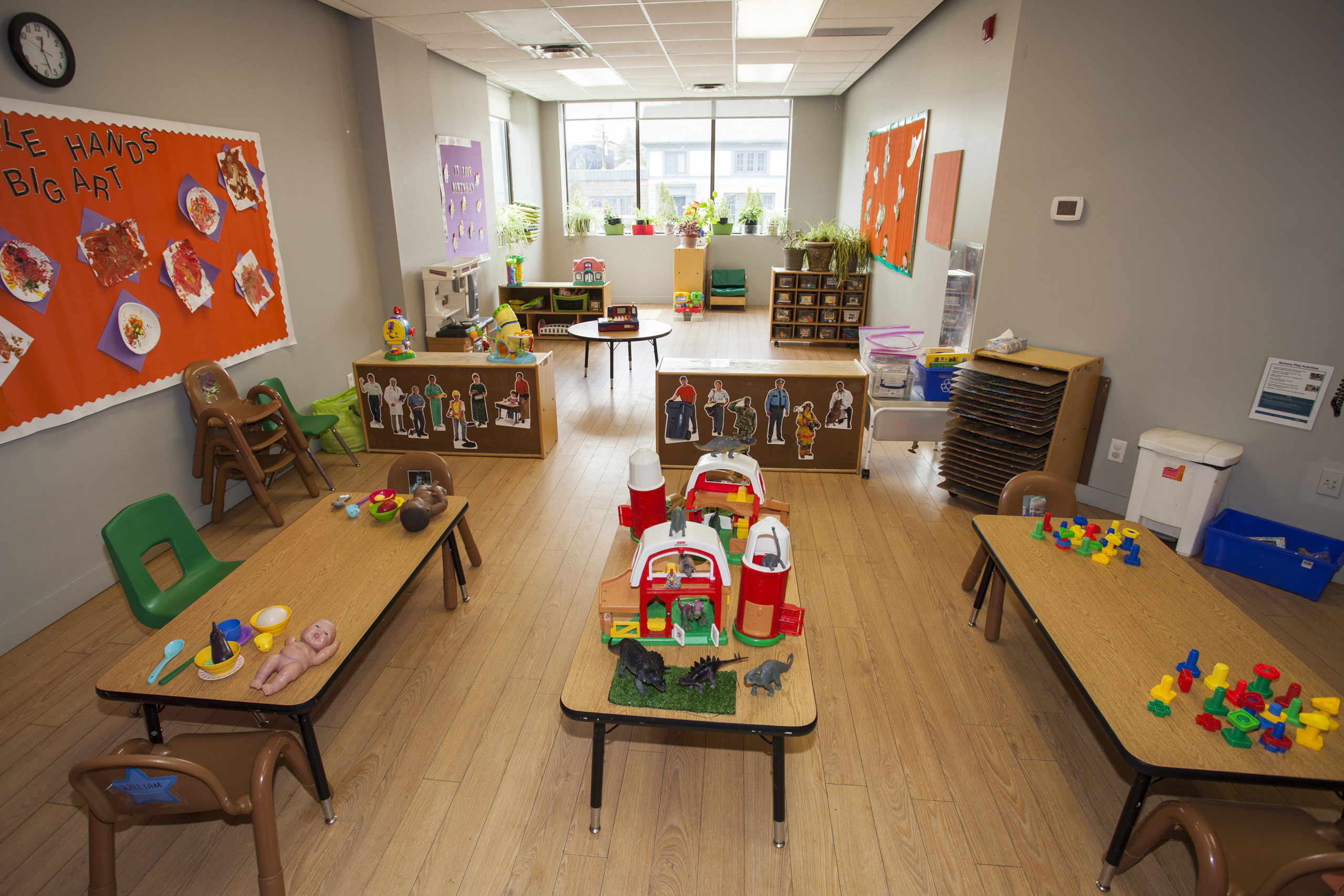toddler room with tables and toys