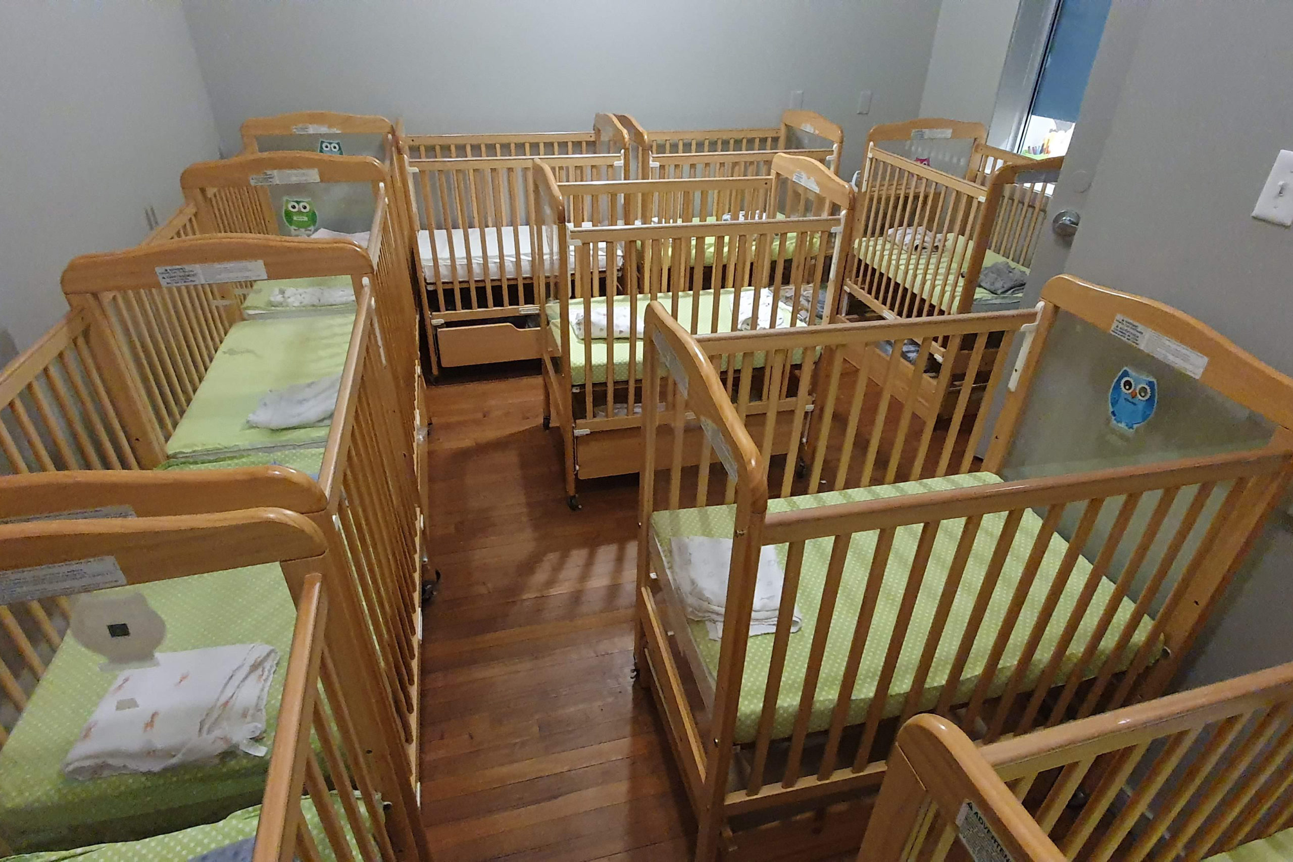 infant sleep room with cribs